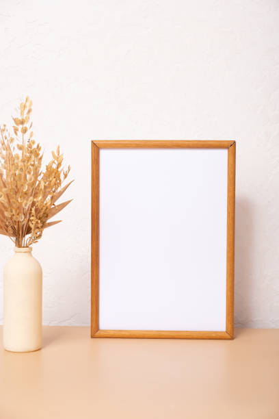 istock Mock up empty wooden frame mockup, dried pampas grass on white background, interior, home design. Art concept. copy space 1411171712