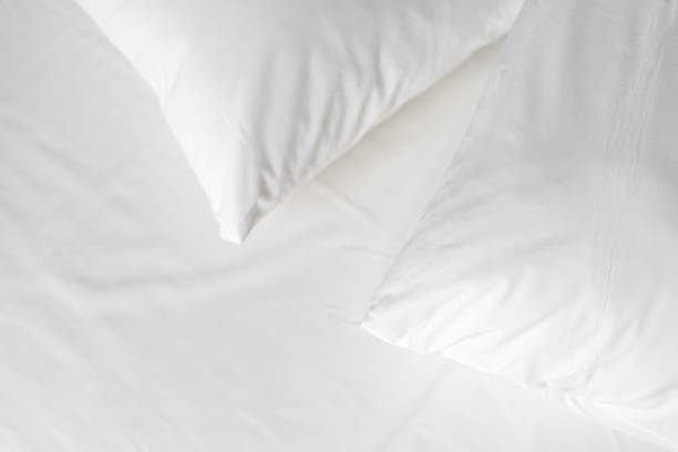 istock Hypoallergenic pillows with memory foam material on white bedsheet 1411172407