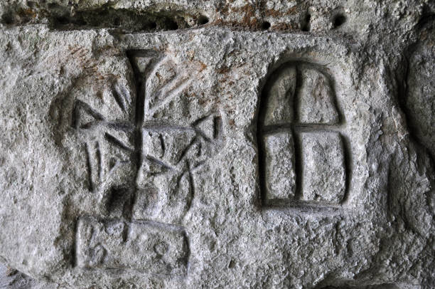 istock Ancient Germanic runes on the wall of the cave 1411175580