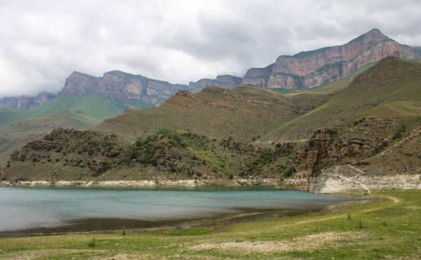 istock turquoise lake Gizhgit with hilly shores 1411177132