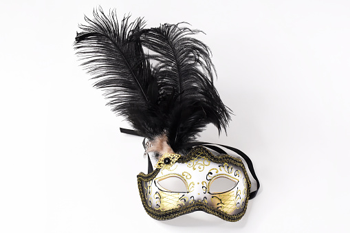 Luxury venetian mask on dark glitter background. Carnival masquerade fantasy mask.