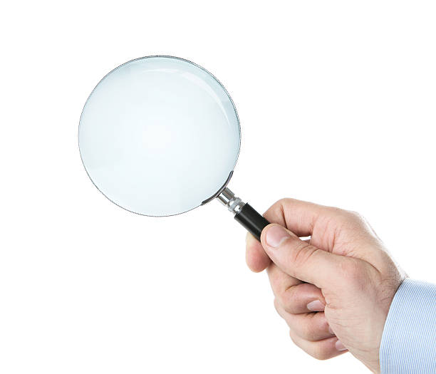 istock Human hand holding magnifying glass 141117974