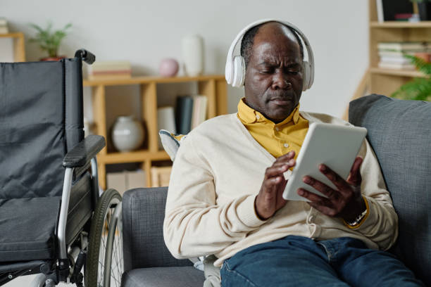 istock Man with disability listening to music 1411181812