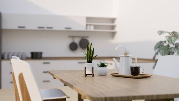 istock Modern minimal wood dining table with decors in modern minimal white dining room and kitchen 1411182184