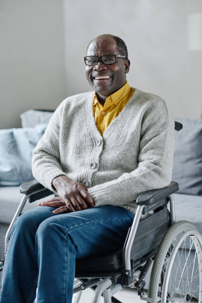 istock Mature man with disability smiling 1411182375