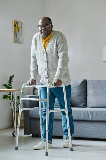 istock Man trying to walk with walker 1411182494