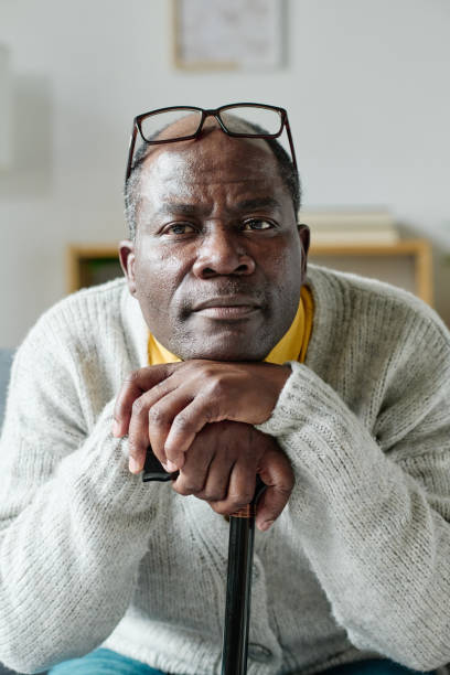 istock African senior man sitting at home 1411182523