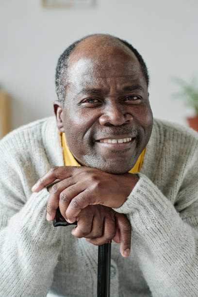 istock Happy African senior man at home 1411182536