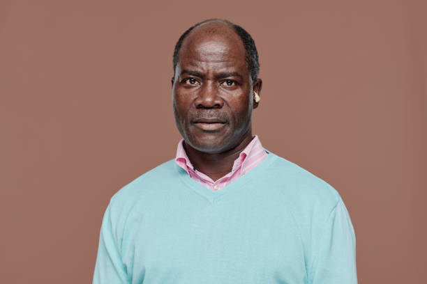 istock African senior man with deafness 1411182712