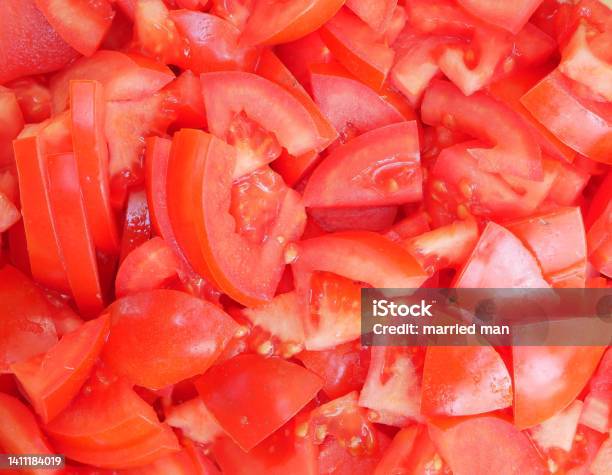Large Red Delicious Tomatoes Sliced For Salad Vitamin Food For Vegetarians Ready To Eat Ripe Fragrant Vegetables Without Spices Stock Photo - Download Image Now