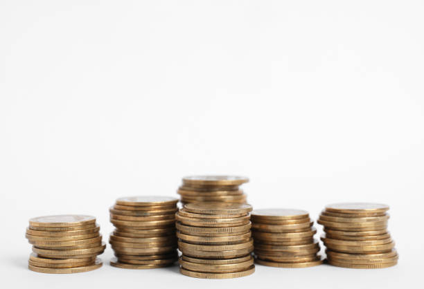 istock Many Euro coins stacked on white background 1411184778