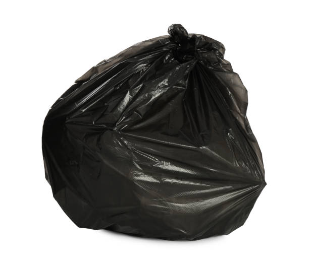 istock Black trash bag filled with garbage isolated on white 1411184781