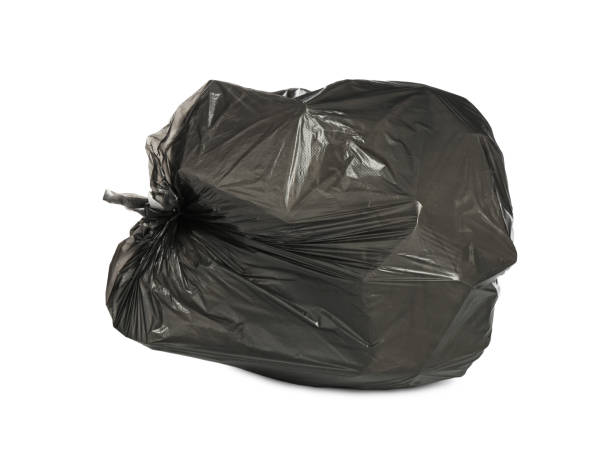 istock Black trash bag filled with garbage isolated on white 1411184846