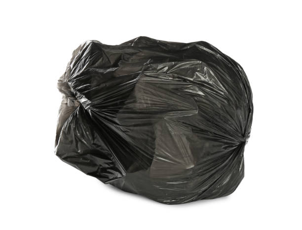 istock Black trash bag filled with garbage isolated on white 1411185246