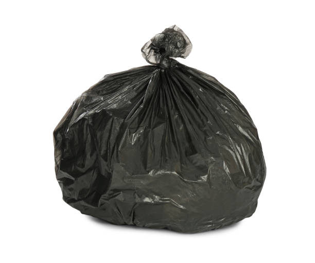 istock Black trash bag filled with garbage isolated on white 1411185292