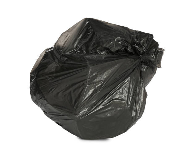 istock Black trash bag filled with garbage isolated on white 1411185303