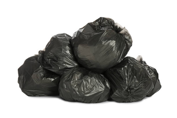istock Black trash bags filled with garbage on white background 1411185848