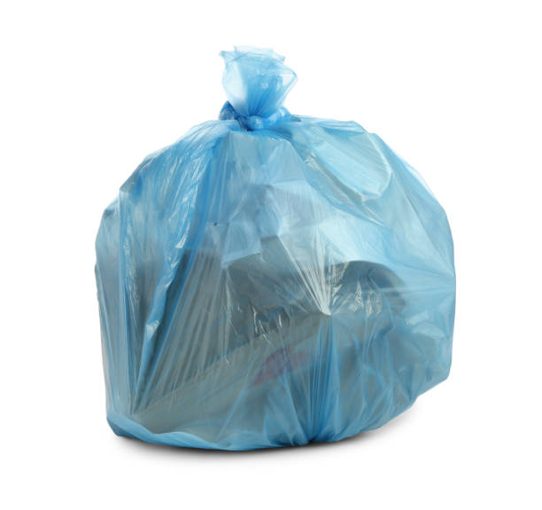 istock Blue trash bag filled with garbage isolated on white 1411185961