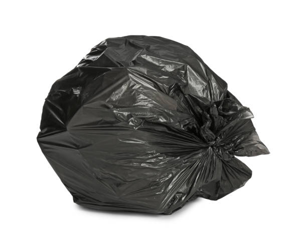 istock Black trash bag filled with garbage isolated on white 1411186662
