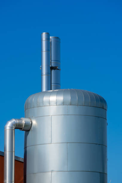 istock Low Angle View Of Storage Tank Against Clear Blue Sky 1411186695