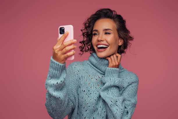 istock Pretty woman using smart phone 1411187290