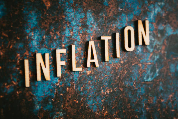 istock Wooden letters spelling the word 'Inflation' on textured surface 1411187408