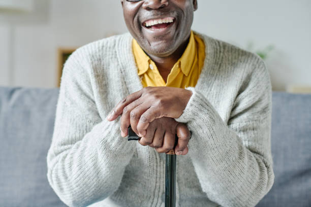 istock Happy senior man with stick 1411187528