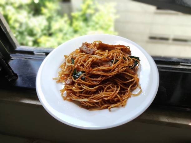 istock Chinese fried noodle menu on white plate 1411188251