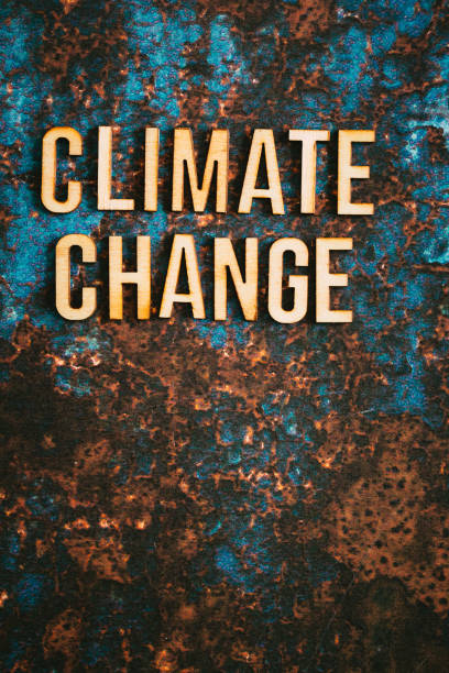 istock Wooden letters spelling words 'Climate Change' on textured background 1411189464