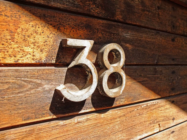 Number 38 on a wooden wall