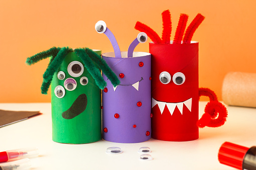 Halloween craft. Handmade decoration cute funny monster. Drawing Handmade toys. Reuse concept