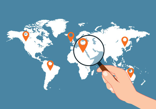 istock Travel concept. Human hand holding holding magnifying glass for finding the best travel destination in summer holiday on world map. 1411194941