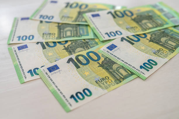 istock beautiful new 100 euro banknotes laid out on a spacious table 1411198821