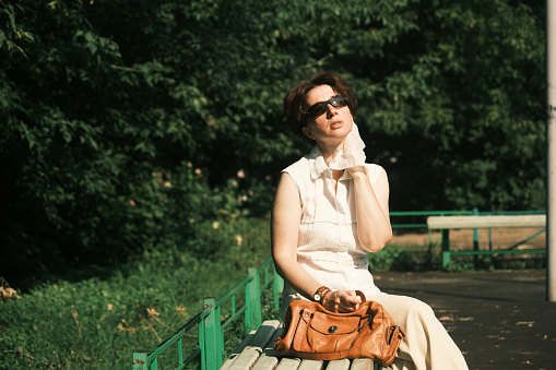 Woman is suffering from heat wave in city