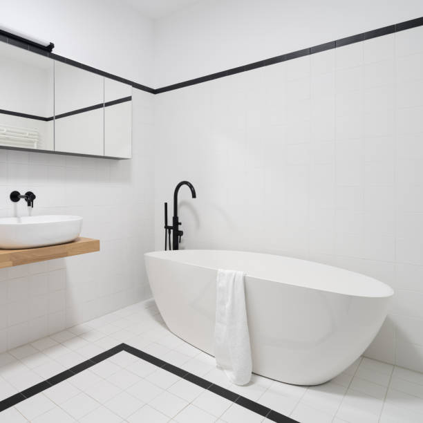 istock Bathtub with black tap in minimalist bathroom 1411199509