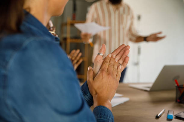 istock Businesswoman applauding her project manager on a successfully held presentation 1411201785
