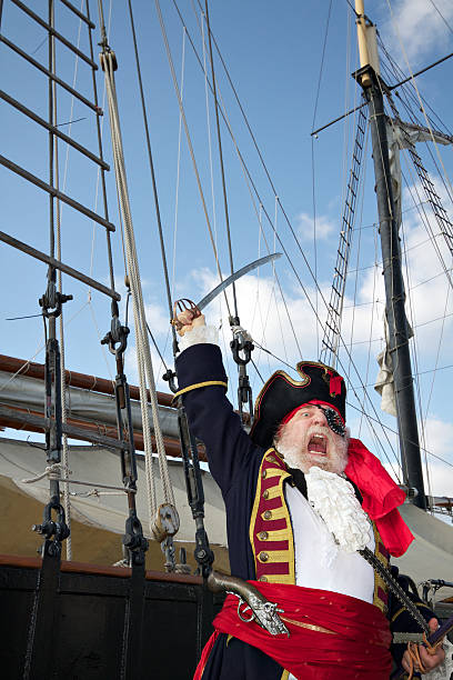 istock Pirate captain on ship shouts and waves sword 141120239