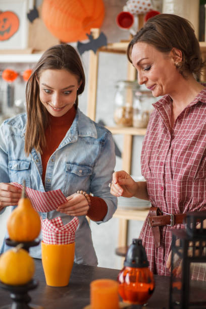 istock Young woman making a funny face while her mother is scolding her 1411203683