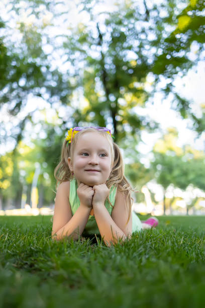 istock little girl model in the park 1411204069