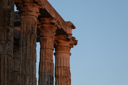 Detail of the capitals and columns of the Temple of Diana at sunset, a Roman temple built in the 1st century AD in the city of Augusta Emerita, capital of the Roman province of Lusitania, now Merida