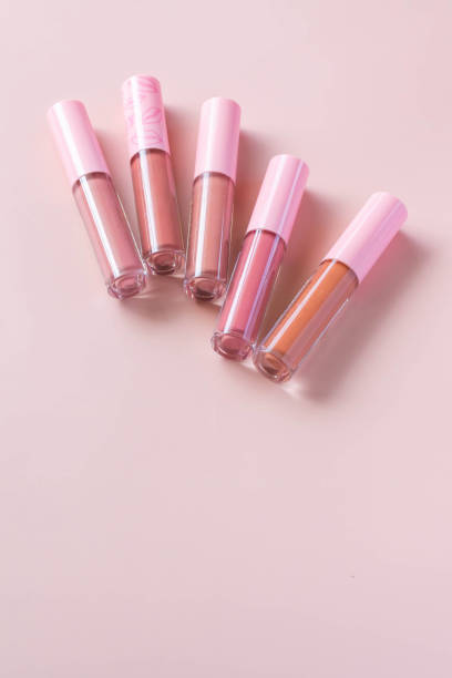 istock Group of different shades liquid lipsticks on the pink background. 1411205435