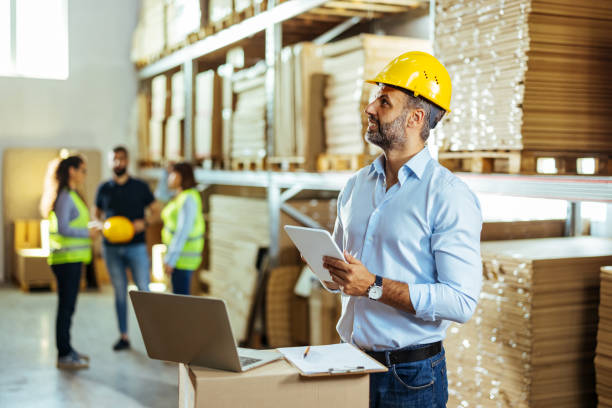 istock Male supervisor inspects cargo delivery status. 1411205814