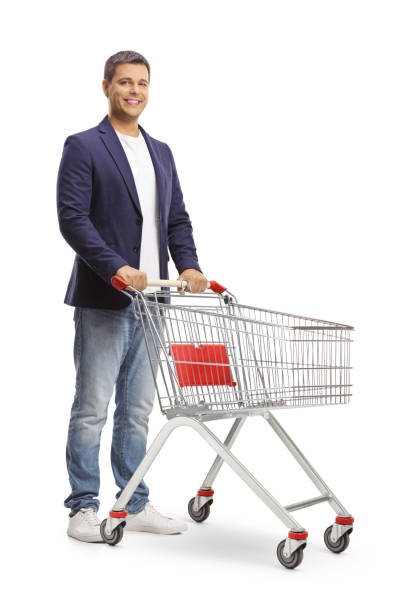 istock Smiling man standing with an empty shopping cart 1411207729