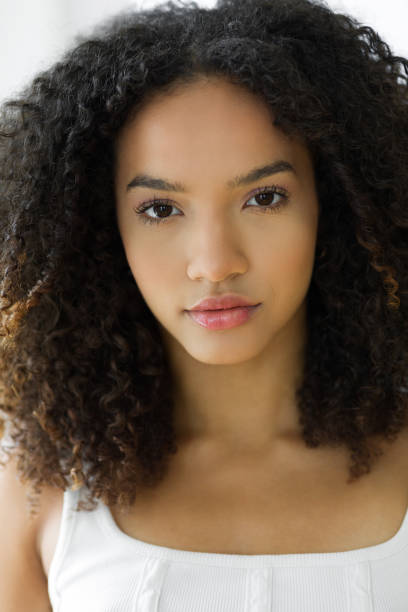 istock Young woman with natural hair 1411207742