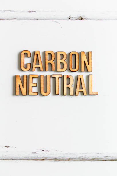 istock Wooden letters spelling words 'Carbon Neutral' on white background 1411207822