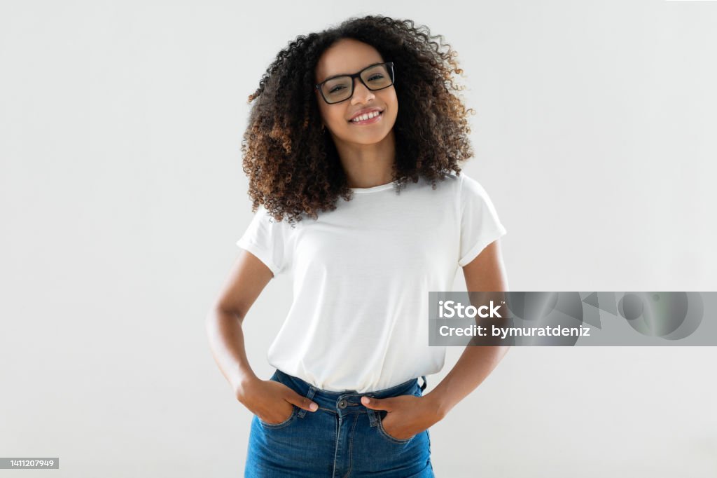 Studio shot of young woman T-Shirt Stock Photo