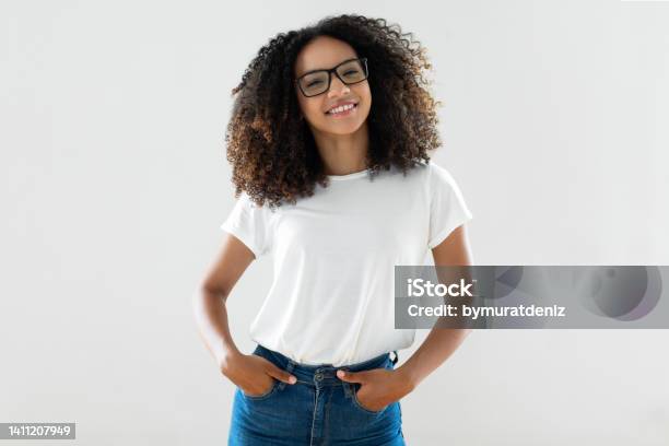 Studio Shot Of Young Woman Stock Photo - Download Image Now - T-Shirt, Women, Student