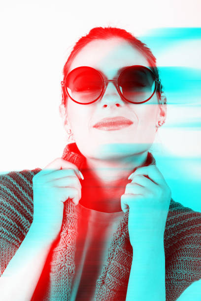 istock Woman with sunglasses and sweater in RGB color split effect 1411209024