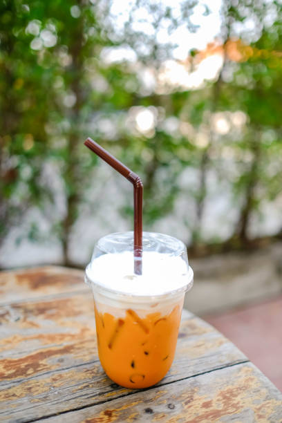istock Iced Thai milk tea on a wooden table. 1411209123