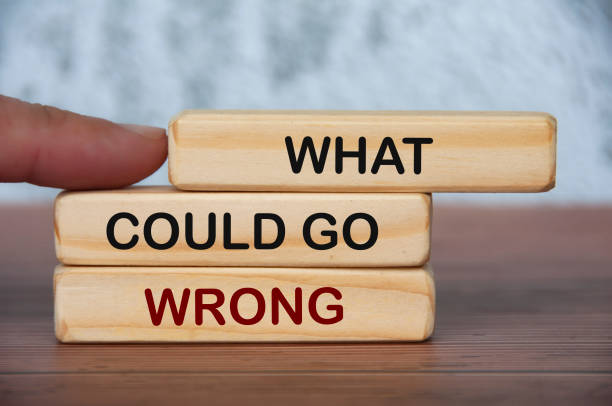 istock What could go wrong text on wooden blocks with blurred marble background. Fact finding concept 1411211645
